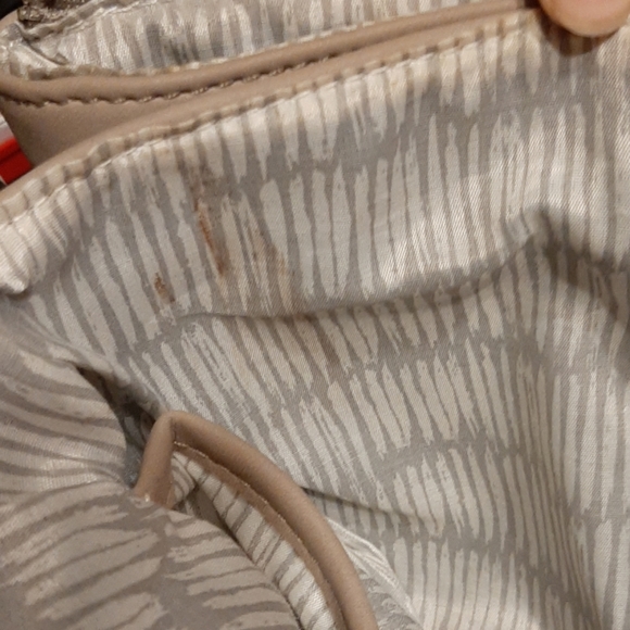 Tan purse with black accents along edges. - Picture 6 of 6